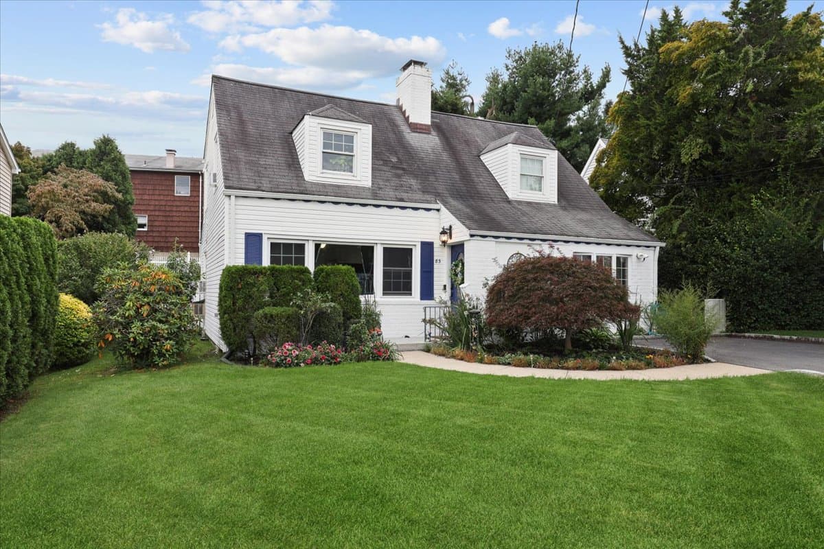 Welcome to 83 Joyce Road, an updated Cape-Colonial located in Huntley Estates, a quiet Eastchester neighborhood featuring a walkable, fenced-in playground. This inviting 4-bedroom, 2-bath home offers a bright and comfortable layout designed for everyday living. The main level features a spacious living room with wood-burning fireplace, dining area with sliders opening to the backyard, private office or flex room, kitchen, utility closet, and a newly renovated full bath with linen closet. The primary bedroom includes a walk-in closet and the convenience of a full-size stackable washer and dryer. Upstairs, three additional bedrooms and a full bath provide plenty of space for family and guests. The private, fenced-in backyard is perfect for outdoor living, featuring a spacious paver patio ideal for dining and entertaining, along with a generous grassy area for play. Easily accessed through the sliders off the dining area, this inviting outdoor space offers the perfect setting for gatherings, playtime, or simply relaxing outdoors. Additional highlights include hardwood floors and recessed lighting. Ideally located near schools, shops, parks, golf, and public transportation, with the train approximately one mile away. Eastchester residents are eligible to purchase membership at Lake Isle Country Club, featuring an 18-hole championship golf course, year-round tennis courts, and five swimming pools. A wonderful opportunity to enjoy comfortable living, inviting outdoor space, and a convenient Eastchester location!