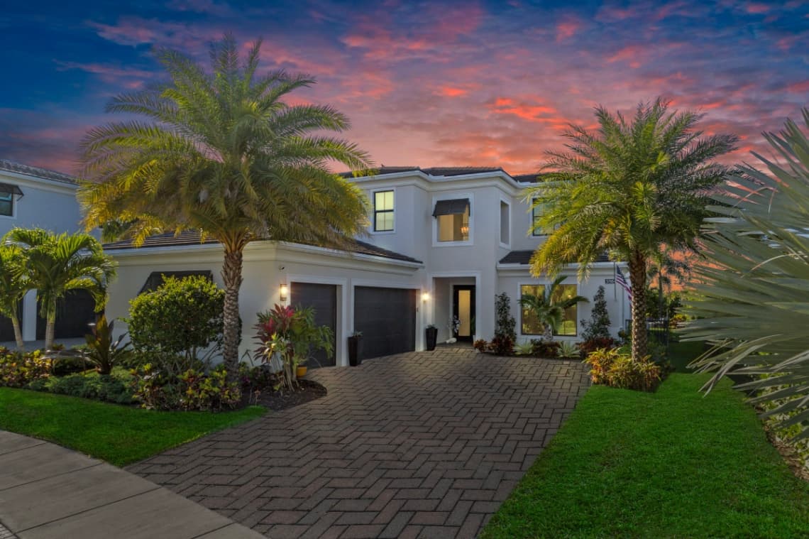 Stunning 4-bedroom, 5-bathroom lakefront estate home in prestigious gated Artistry.